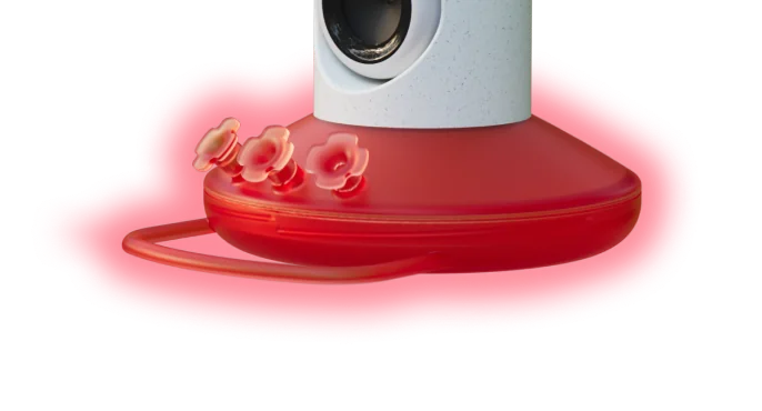 The red base and flower ports of the Smart Hummingbird Feeder